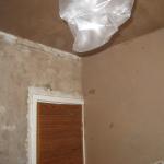 Plastering Day 1 - back wall and ceiling done (looking at door wall)