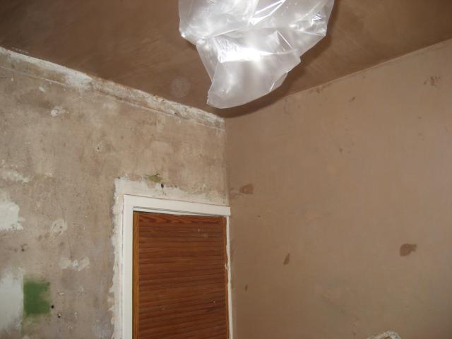 Plastering Day 1 - back wall and ceiling done (looking at door wall)