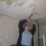 Kerri stripping the ceiling
